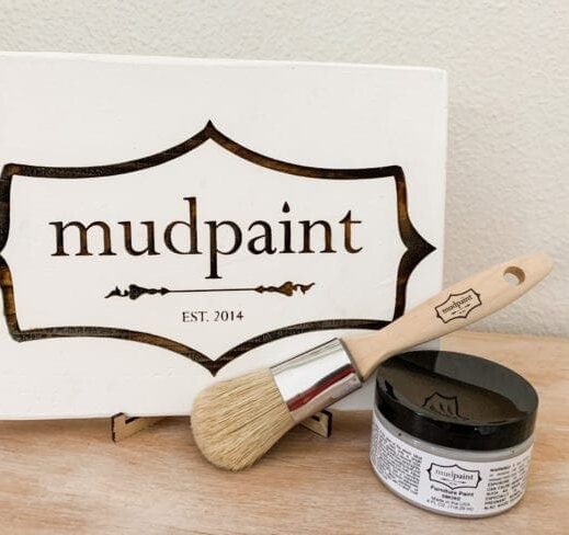 mudpaint clay furniture paint branded sign sitting on an easel with a white backdrop