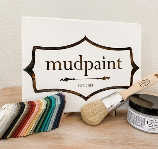 mudpaint clay furniture paint branded sign sitting on an easel with a white backdrop