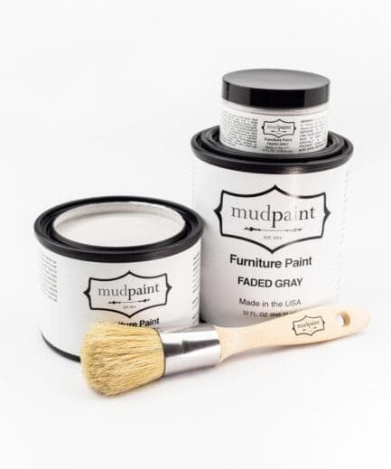 various containers of faded clay paint