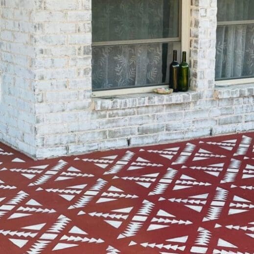 concrete floor painted in dark red clay furniture paint by MudPaint