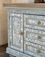 beautifully stencilled cabinet painted in light baby blue suede blue clay furniture paint by MudPaint